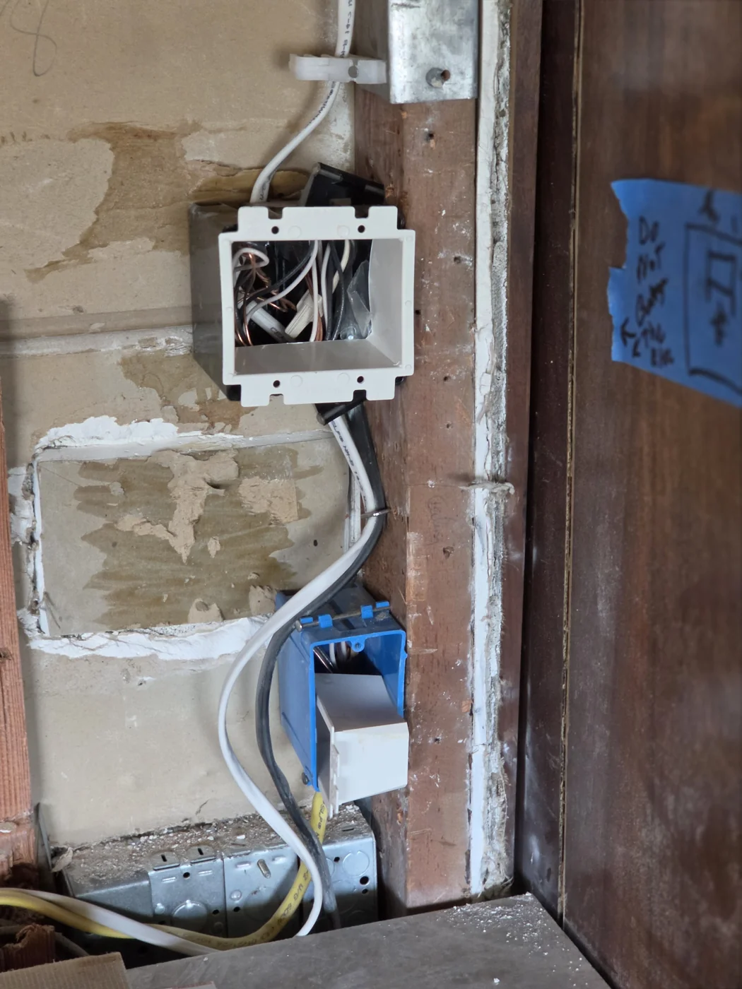 Open electrical device boxes and wiring during a home remodel